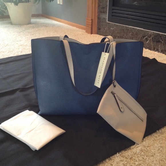 Madison West Handbags - NWT beautiful blue bag that reverses to cream